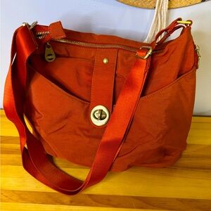 Baggallini Sunset Orange Hobo
Concealer Carry style side pockets